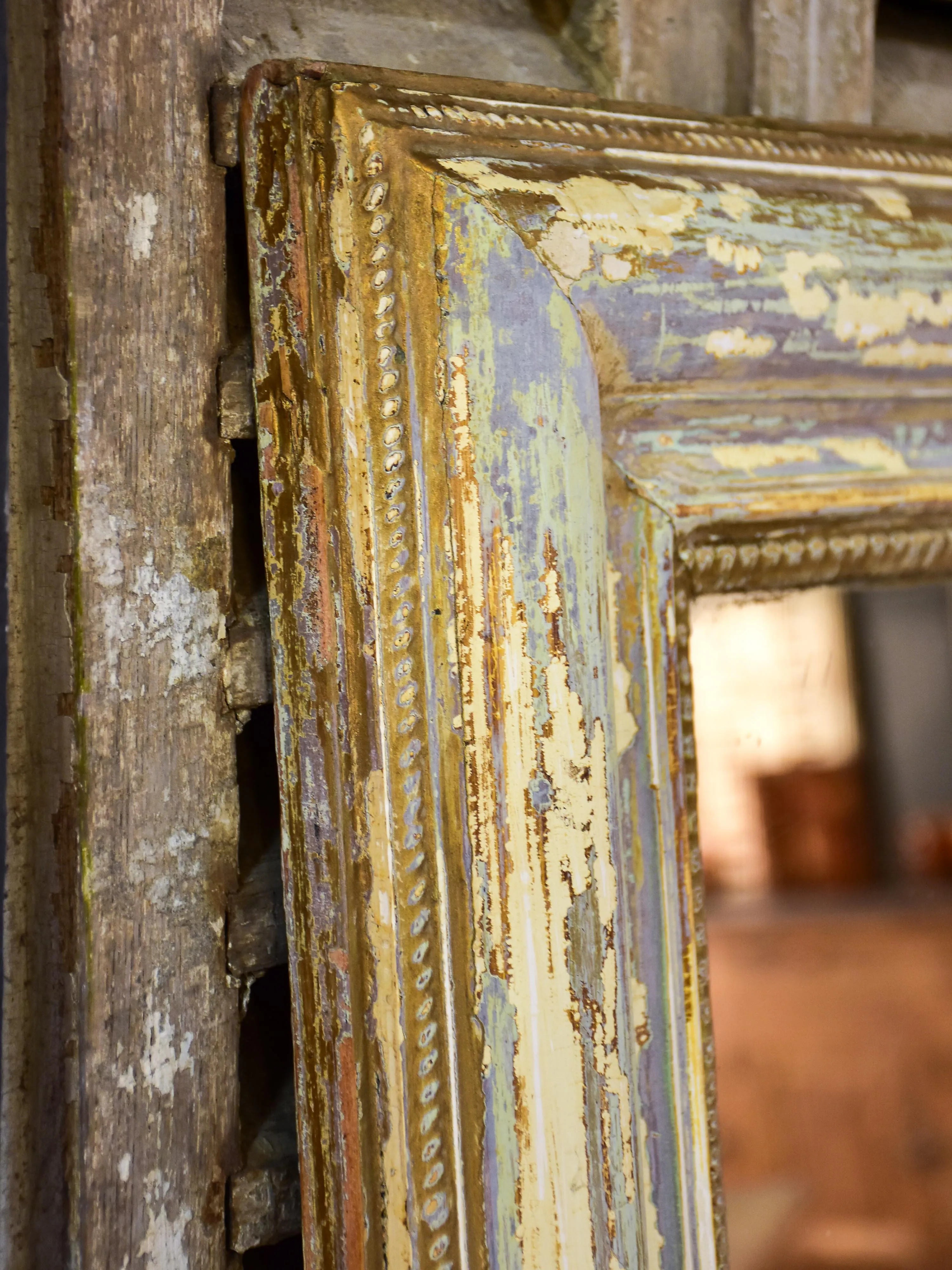 Large 19th century Louis XVI mirror with patinated frame